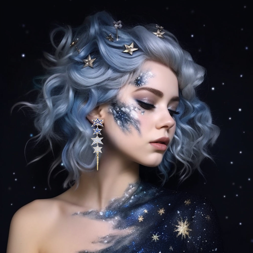 Starplay Earrings by Unhada - Reach for the stars with these bold statement earrings. A captivating linear design features a cascade of stylized stars, each sterling silver star adorned with shimmering ombre blue sapphires (1.06 cts). The design tapers down gracefully, ending with a line of graduated bezel-set sapphires and diamonds (.23 cts) in radiant 18k yellow gold, creating a stunning contrast that catches the light from every angle. At a bold 2 inches in length, these earrings are secured with post ba