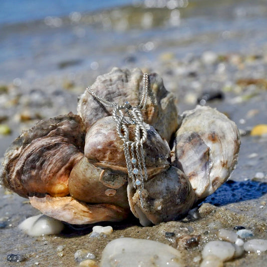 Introducing the Marvel Necklace, Unhada's first sterling silver piece, made in partnership with Turquoise Mountain, an organization that works directly with artisans in Afghanistan to protect heritage and communities at risk around the world. Handmade in sterling silver and accented with aquamarines. 16 - 18" adjustable chain. Profits from crafting this limited edition piece go directly to the craftspeople.