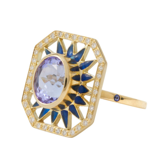 Fate Ring by Unhada - A dazzling tribute to Art Deco design, the one-of-a-kind Fate Ring features an oval-cut tanzanite (2.56 cts) set against a rich blue enamel starburst. Framed by brilliant diamonds, this 18k gold creation is a harmonious blend of vintage inspiration and modern craftsmanship. A striking piece destined to make its mark. Size 6.5. Price available upon request.