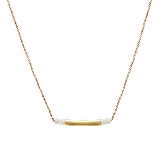 Embodying the art of simplicity, the Qi Necklace blends serene opal beads with the understated beauty of a matte 18k elongated vessel. Set on a delicate 18k gold chain, with an adjustable length of length 16-17", this piece offers a subtle yet refined elegance, perfect for every day. 
