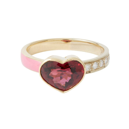 The Garnet Heart Tea Party Band is a love letter in gemstone form. A rich, 2.76 ct garnet heart takes center stage, its deep crimson hue glowing against a delicate band of pink enamel with diamonds that add a touch of light. Set in warm 18k gold, this one-of-a-kind ring is undeniably romantic. Set in warm 18k gold, this one-of-a-kind ring is undeniably romantic. Currently a size 7.5, it can be resized for the perfect fit—a keepsake to cherish.