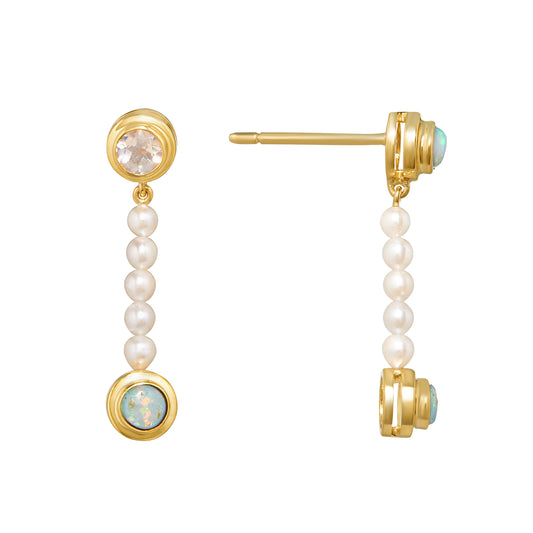 Prim & Proper Earrings by Unhada -Exuding ladylike charm, the Prim & Proper Earrings delight with their playful mismatched design. Bezel-set opals and moonstones (.86 cts) shine in 18k yellow gold, while delicate pearl drops add a soft, feminine touch. At .87" in length, these earrings are the perfect blend of whimsy and refinement.