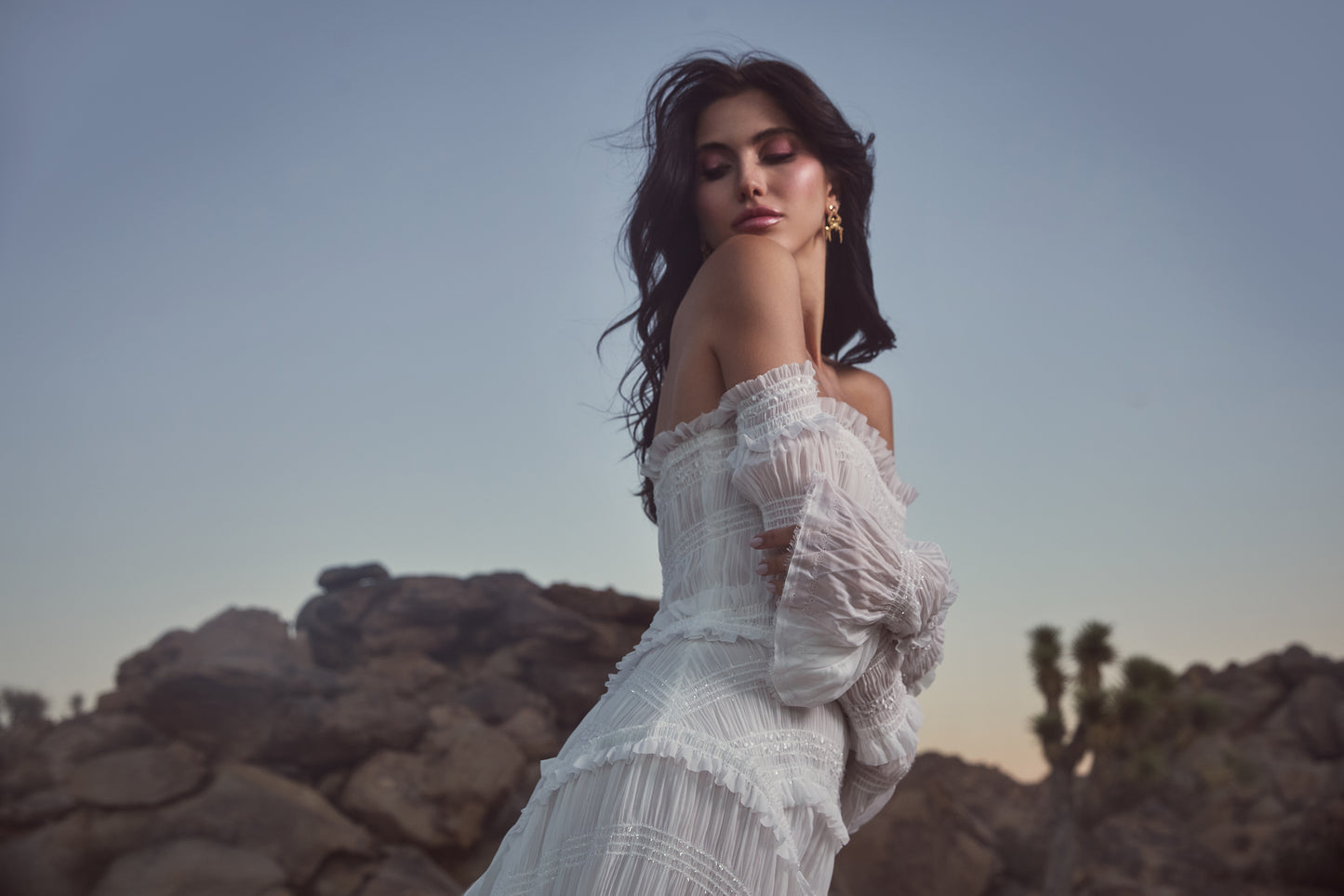 Unhada sapphire bow statement earrings eatured in the Watters Bridal campaign.